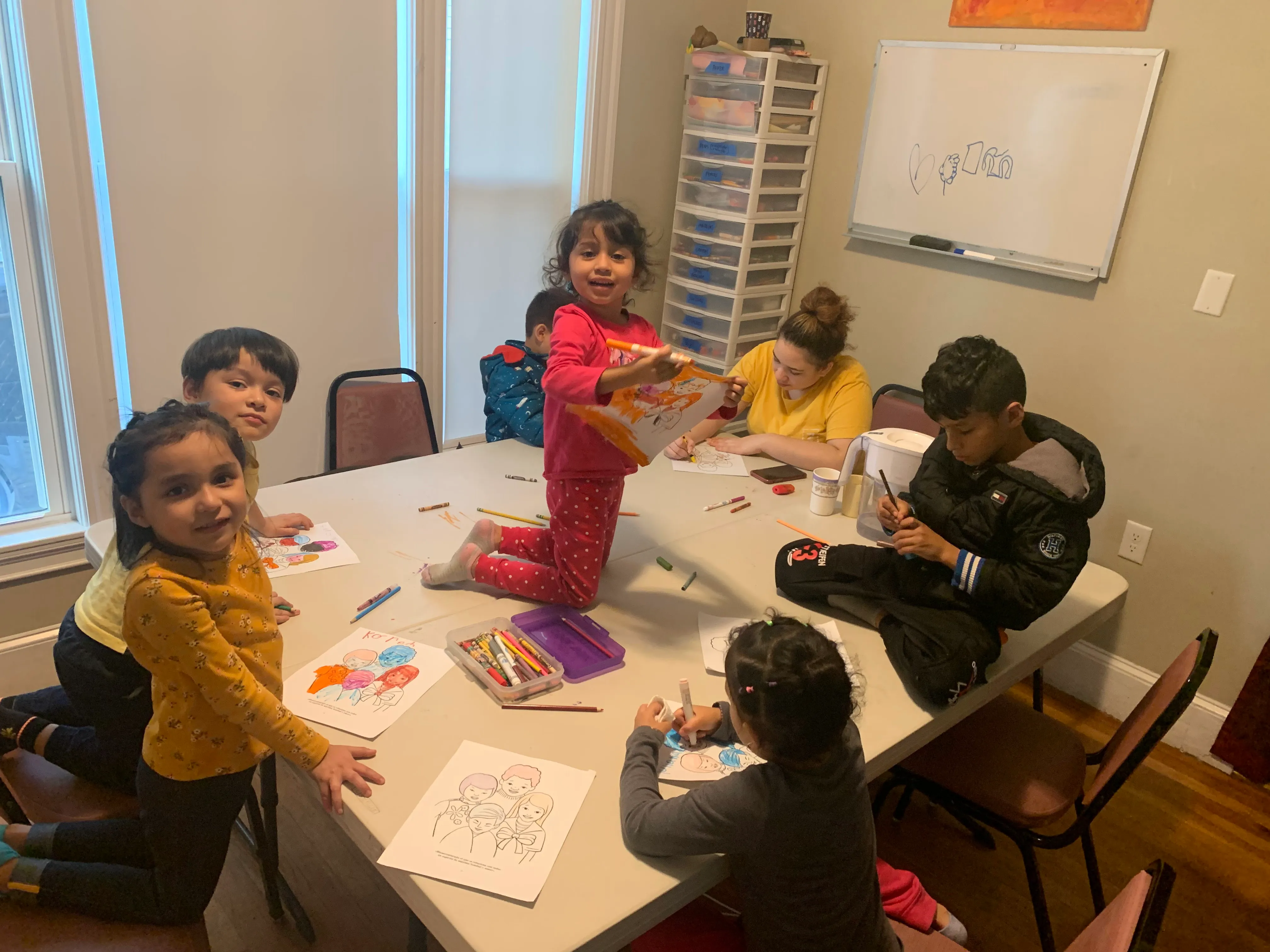 Child at a table during a children's class in Chelsea