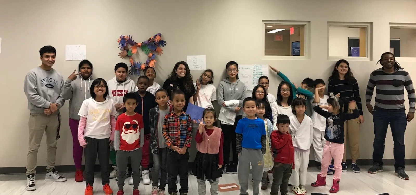 A large children's class with its teachers and mentors