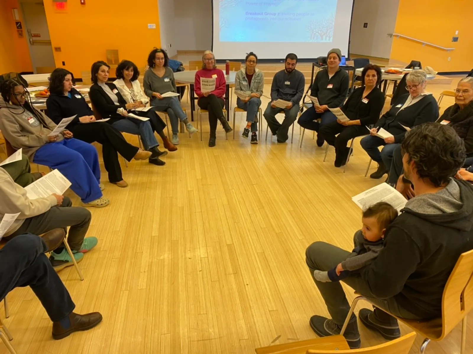 People seated in a circle mid-discussion