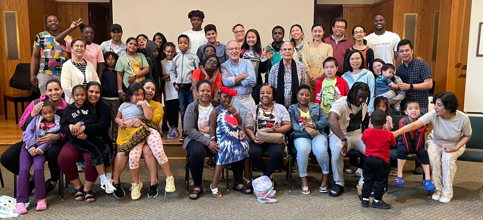 A large community gathering spanning small children through grandparents