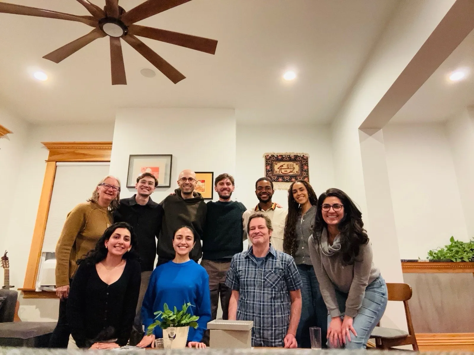 Friends gathered around a table with tea