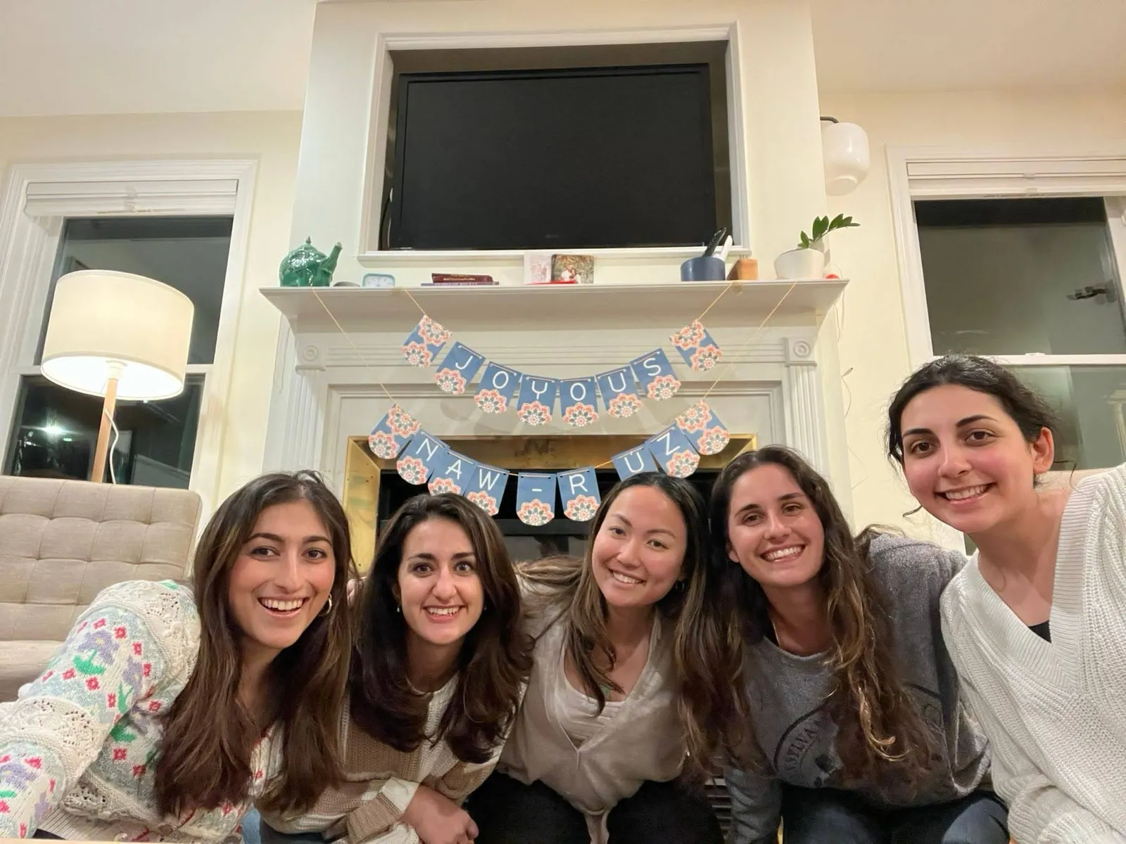 Friends together at a Naw-Ruz celebration in a living room