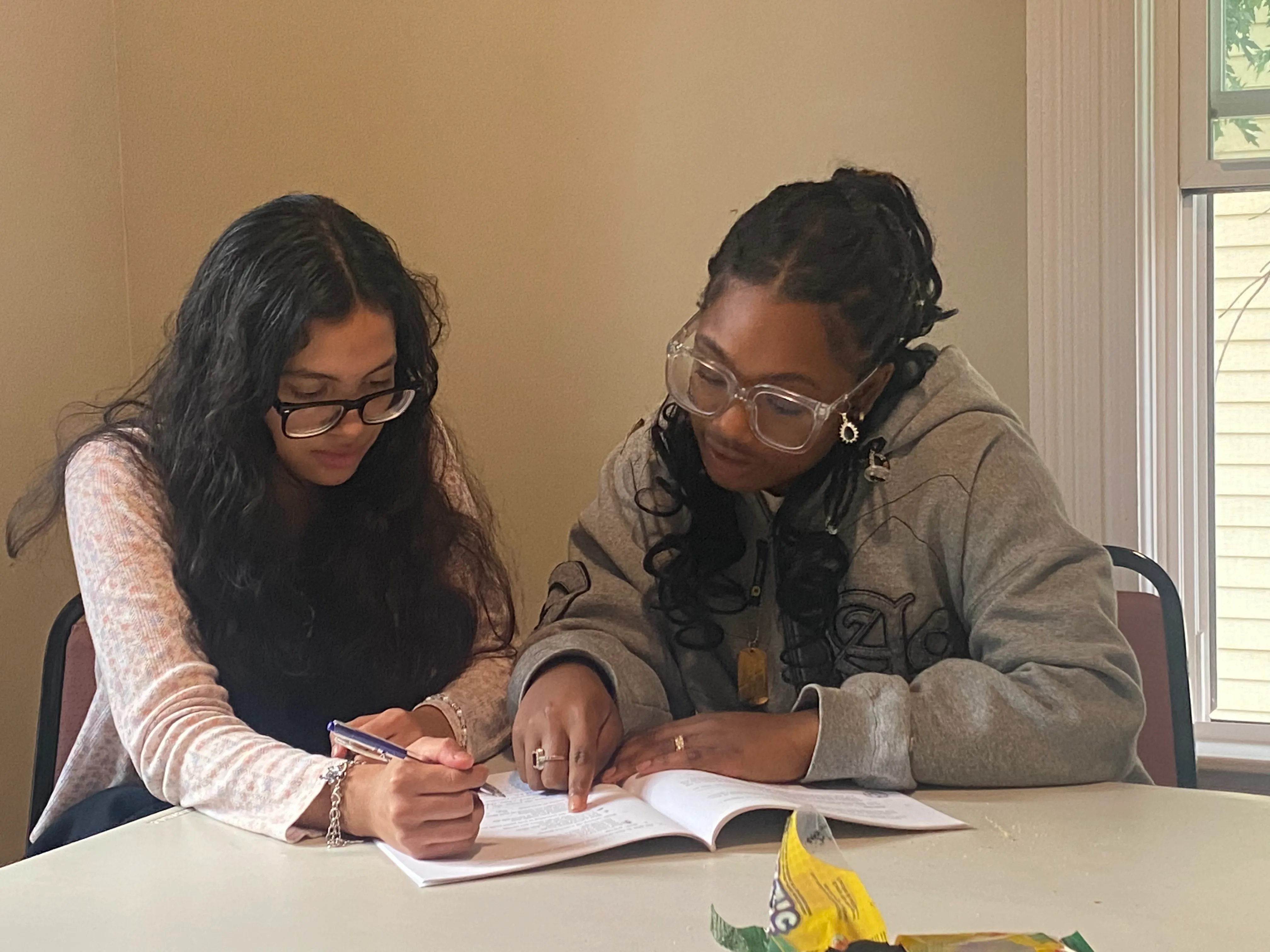 Teen studying with focus during a junior youth session