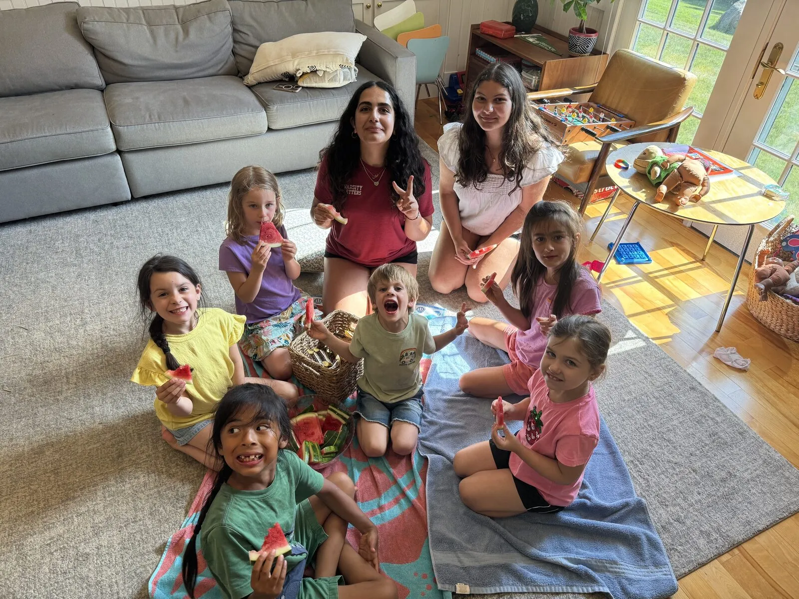 Children sitting in a circle doing an art project together