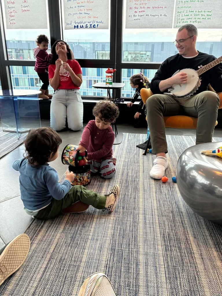Toddlers and caregivers playing together