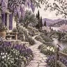 A lush spring garden with a stone path, small bridge, stream and birds.