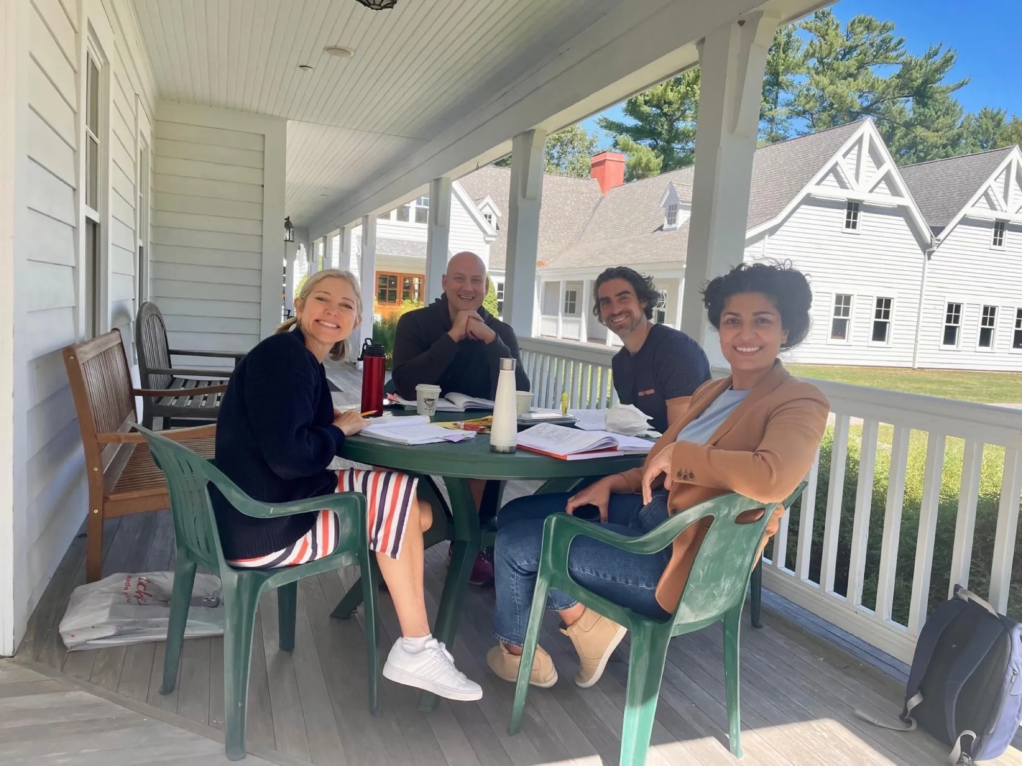 Small group studying together on a porch